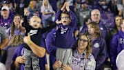 Young Kansas State Wildcats fans cheer after a Wildcats touchdown during the fourth quarter against the TCU Horned Frogs at Bill Snyder Family Football Stadium. Mandatory Credit: Scott Sewell-Imagn Images