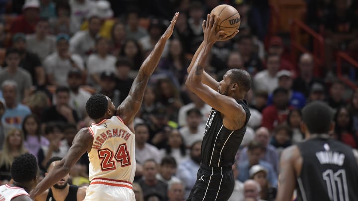 Jan 8, 2023; Miami, Florida, USA; Brooklyn Nets forward Kevin Durant (7) scores over Miami Heat forward Haywood Highsmith during the first quarter of their game at FTX Arena. Mandatory Credit: Michael Laughlin-USA TODAY Sports