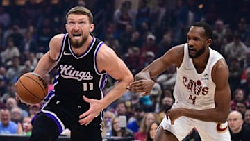 Apr 6, 2025; Cleveland, Ohio, USA; Sacramento Kings forward Domantas Sabonis (11) drives to the basket against Cleveland Cavaliers forward Evan Mobley (4) during the first quarter at Rocket Arena. Mandatory Credit: Ken Blaze-Imagn Images