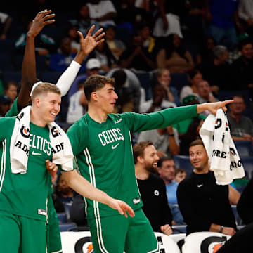 Oct 8, 2025; Memphis, Tennessee, USA; Boston Celtics guard Hugo Gonzalez (28), forward Baylor Scheierman (55) and center Luka Garza (52) react during the second quarter against the Memphis Grizzlies at FedExForum. Mandatory Credit: Petre Thomas-Imagn Images