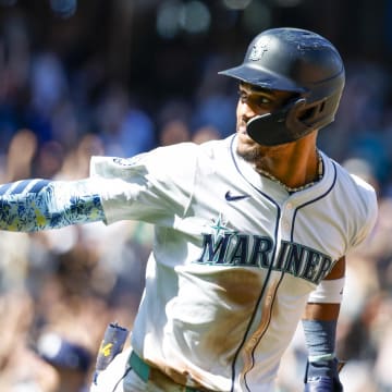 Seattle Mariners center fielder Julio Rodriguez (44) points back to the dugout after hitting a two-run home run against the Tampa Bay Rays during the fifth inning at T-Mobile Park on Aug 27.