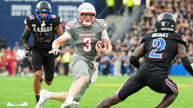 Sep 13, 2024; Kansas City, Kansas, USA; UNLV Rebels quarterback Matthew Sluka (3) runs the ball against Kansas Jayhawks defen