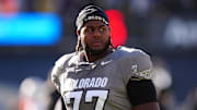 Nov 16, 2024; Boulder, Colorado, USA; Colorado Buffaloes offensive tackle Jordan Seaton (77) looks on before the game against the Utah Utes at Folsom Field. Mandatory Credit: Ron Chenoy-Imagn Images