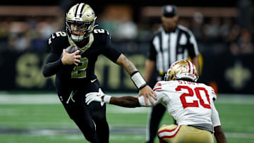 New Orleans Saints QB Spencer Rattler (2) scrambles past San Francisco 49ers CB Upton Stout (20) in an early afternoon matchup on Sep. 14, 2025.
