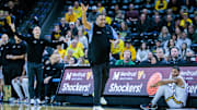 Feb 23, 2025; Wichita, Kansas, USA; Tulane Green Wave Ron Hunter reacts to play during the first half against the Wichita State Shockers at Charles Koch Arena.