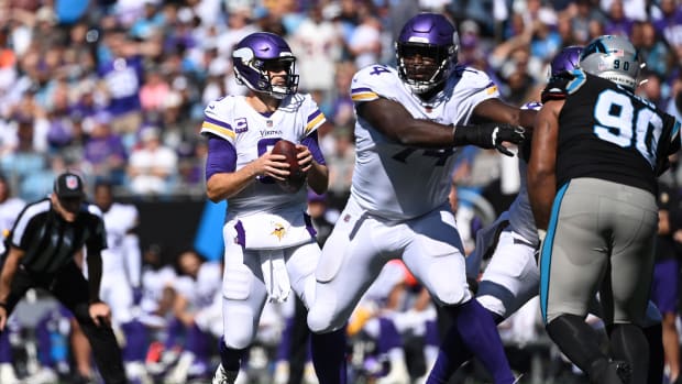 Oct 17, 2021; Minnesota Vikings guard Oli Udoh (74) blocks for quarterback Kirk Cousins against the Carolina Panthers 