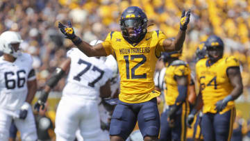 Aug 31, 2024; Morgantown, West Virginia, USA; West Virginia Mountaineers safety Anthony Wilson Jr. (12) celebrates after a play during the first quarter against the Penn State Nittany Lions at Mountaineer Field at Milan Puskar Stadium. Mandatory Credit: Ben Queen-USA TODAY Sports