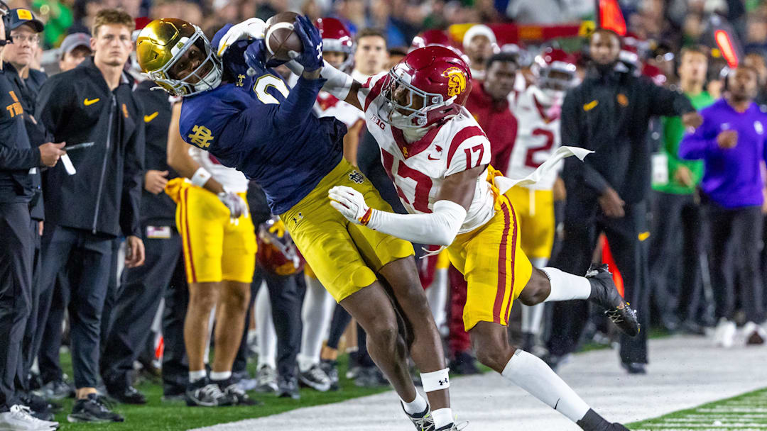 Oct 18, 2025; South Bend, Indiana, USA; Southern California Trojans cornerback Decarlos Nicholson (17) forces Notre Dame Fighting Irish wide receiver Malachi Fields (0) out of bounds as he tries to complete a catch during the first half at Notre Dame Stadium. Mandatory Credit: Michael Caterina-Imagn Images