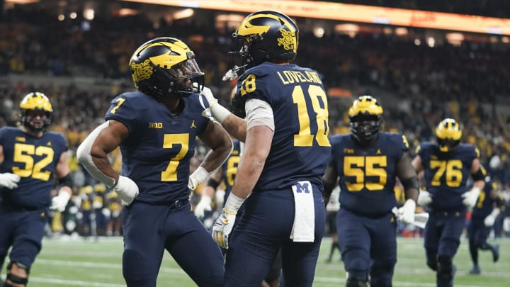 Dec 3, 2022; Indianapolis, Indiana, USA;  Michigan Wolverines running back Donovan Edwards (7) celebrates with ight end Colston Loveland (18) after Loveland scored a touchdown during the first half of the Big Ten Championship against the Purdue Boilermakers at Lucas Oil Stadium.