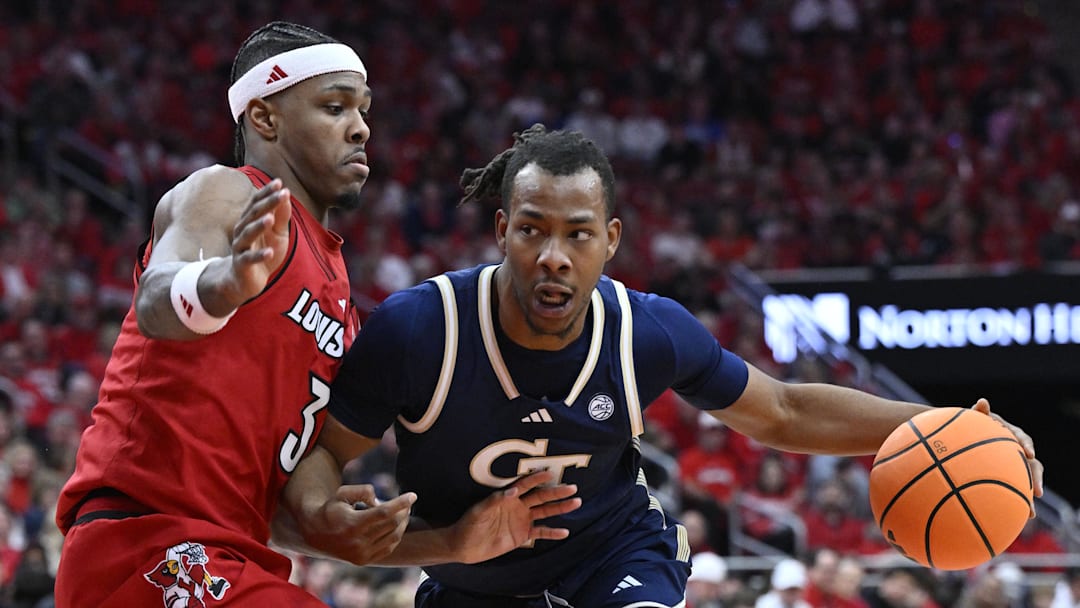 Feb 21, 2026; Louisville, Kentucky, USA; Georgia Tech Yellow Jackets guard Lamar Washington (1) dribbles against Louisville Cardinals guard Ryan Conwell (3) during the first half at KFC Yum! Center. Mandatory Credit: Jamie Rhodes-Imagn Images Feb 21, 2026; Louisville, Kentucky, USA; Georgia Tech Yellow Jackets guard Lamar Washington (1) dribbles against Louisville Cardinals guard Ryan Conwell (3) during the first half at KFC Yum! Center. Mandatory Credit: Jamie Rhodes-Imagn Images
