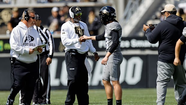 Apr 19, 2025; Boulder, CO, USA; Colorado Buffaloes head coach Deion Sanders and place kicker Buck Buchanan (43) during the sp