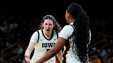Iowa center Ava Heiden (5) high-fives Iowa guard Journey Houston (8) during a basketball game against the Western Illinois Leathernecks Nov. 26, 2025 at Carver-Hawkeye Arena in Iowa City, Iowa.