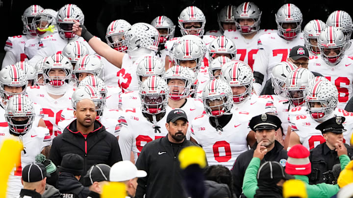 Ohio State Buckeyes head coach Ryan Day leads his team onto the field for the NCAA football game against the Michigan Wolverines at Michigan Stadium in Ann Arbor, Mich. on Nov. 29, 2025. Ohio State won 27-9.