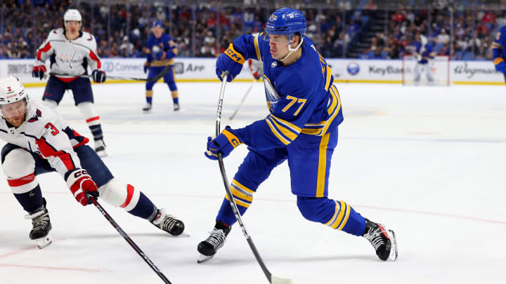 Apr 11, 2024; Buffalo, New York, USA;  Washington Capitals defenseman Nick Jensen (3) tries to block a shot by Buffalo Sabres right wing JJ Peterka (77) during the second period at KeyBank Center. Mandatory Credit: Timothy T. Ludwig-USA TODAY Sports