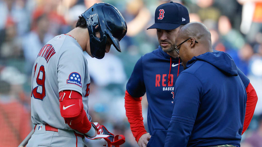 May 4, 2026; Detroit, Michigan, USA; Boston Red Sox left fielder Roman Anthony (19) is checked on by interim manager Chad Tracy (17) and the trainer in the first inning against the Detroit Tigers at Comerica Park. Mandatory Credit: Rick Osentoski-Imagn Images