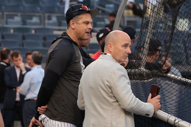 Oct 11, 2022; Bronx, New York, USA; Yankees’ Aaron Boone, Brian Cashman watch batting practice.