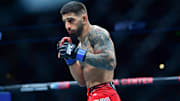 Feb 17, 2024; Anaheim, California, USA; Ilia Topuria fights against Alexander Volkanovski during UFC 298 at Honda Center. Mandatory Credit: Gary A. Vasquez-Imagn Images