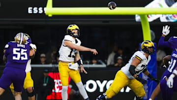 Oct 5, 2024; Seattle, Washington, USA; Michigan Wolverines quarterback Jack Tuttle (13) passes against the Washington Huskies during the second quarter at Alaska Airlines Field at Husky Stadium. Mandatory Credit: Joe Nicholson-Imagn Images