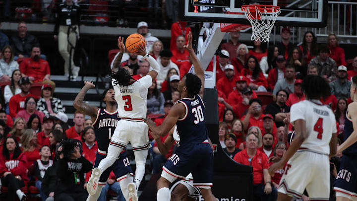 Jan 18, 2025; Lubbock, Texas, USA;  Texas Tech Red Raiders guard Elijah Hawkins (3) goes to the basket against Arizona Wildcats forward Tobe Awaka (30) in the second half at United Supermarkets Arena. Mandatory Credit: Michael C. Johnson-Imagn Images