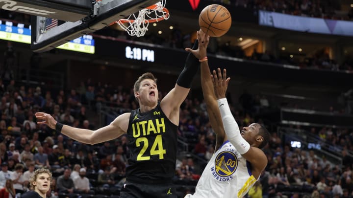 Feb 12, 2024; Salt Lake City, Utah, USA;  Utah Jazz center Walker Kessler (24) blocks the shot of Golden State Warriors forward Jonathan Kuminga (00) during the second half at Delta Center. Mandatory Credit: Chris Nicoll-USA TODAY Sports