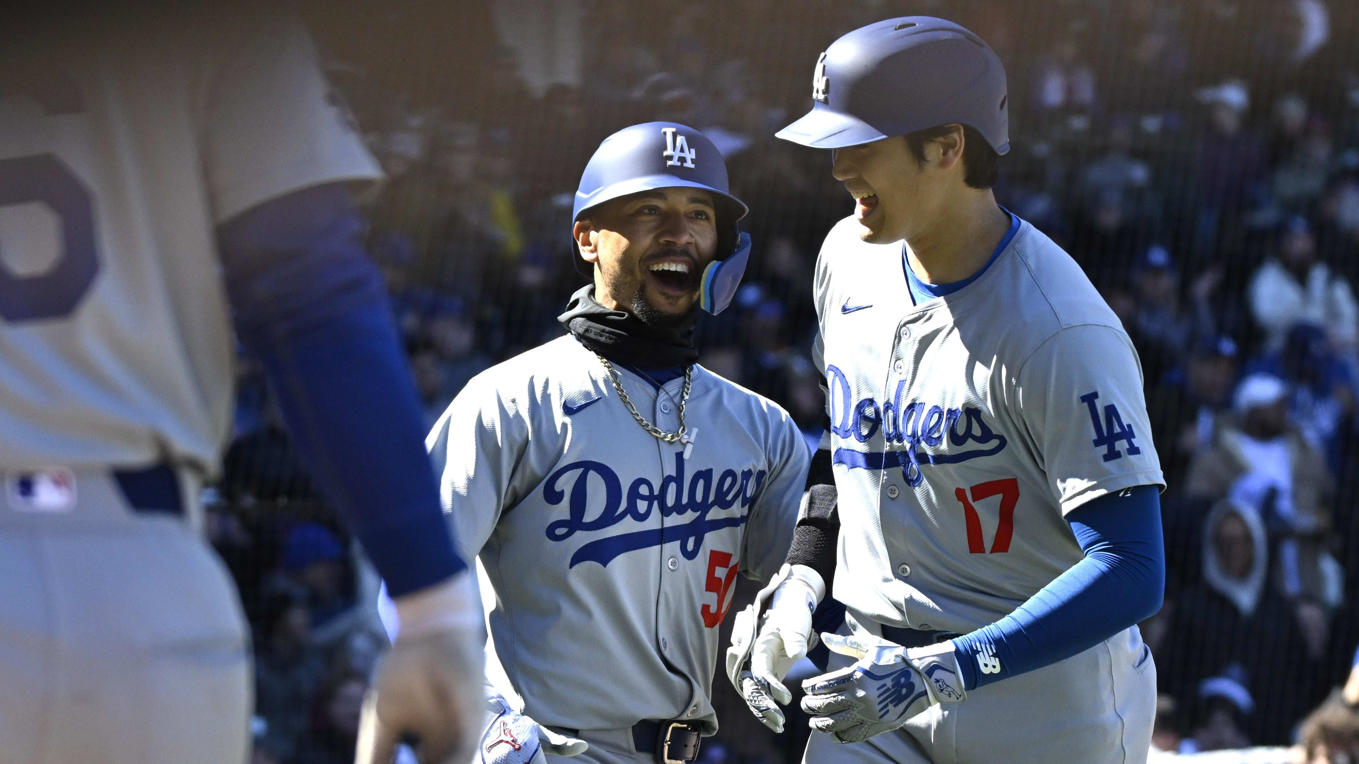 Los Angeles Dodgers two-way player Shohei Ohtani (17) and shortstop Mookie Betts celebrate losing their series to the Chicago Cubs over the weekend. 