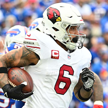 Sep 8, 2024; Orchard Park, New York, USA; Arizona Cardinals running back James Conner (6) runs with the ball against the Buffalo Bills in the third quarter at Highmark Stadium. Mandatory Credit: Mark Konezny-Imagn Images