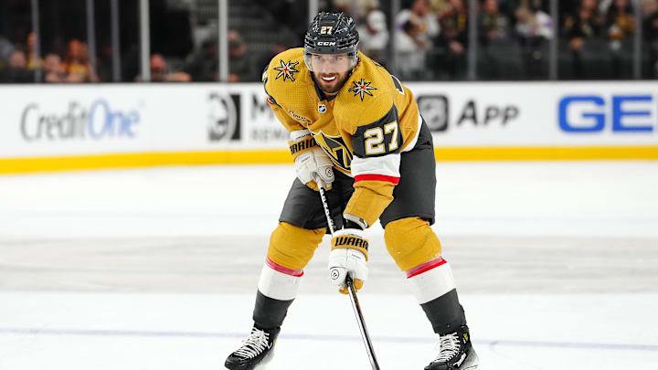 Oct 17, 2023; Las Vegas, Nevada, USA; Vegas Golden Knights defenseman Shea Theodore (27) prepares for a face off against the Dallas Stars during the third period at T-Mobile Arena. Mandatory Credit: Stephen R. Sylvanie-Imagn Images