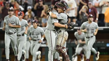 Jun 22, 2024; Omaha, NE, USA;  Texas A&M Aggies pitcher Evan Aschenbeck (53) and catcher Jackson Appel (20) celebrate after defeating the Tennessee Volunteers at Charles Schwab Field Omaha. Mandatory Credit: Steven Branscombe-USA TODAY Sports