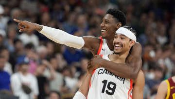 Aug 2, 2024; Villeneuve-d'Ascq, France; Canada small forward RJ Barrett (9) and point guard Andrew Nembhard (19) celebrate after defeating Spain in a men’s group A basketball game during the Paris 2024 Olympic Summer Games at Stade Pierre-Mauroy. Mandatory Credit: John David Mercer-USA TODAY Sports