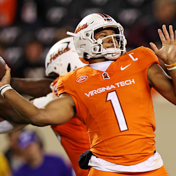 Oct 17, 2024; Blacksburg, Virginia, USA; Virginia Tech Hokies quarterback Kyron Drones (1) throws a pass during the third quarter against the Boston College Eagles at Lane Stadium. Mandatory Credit: Peter Casey-Imagn Images