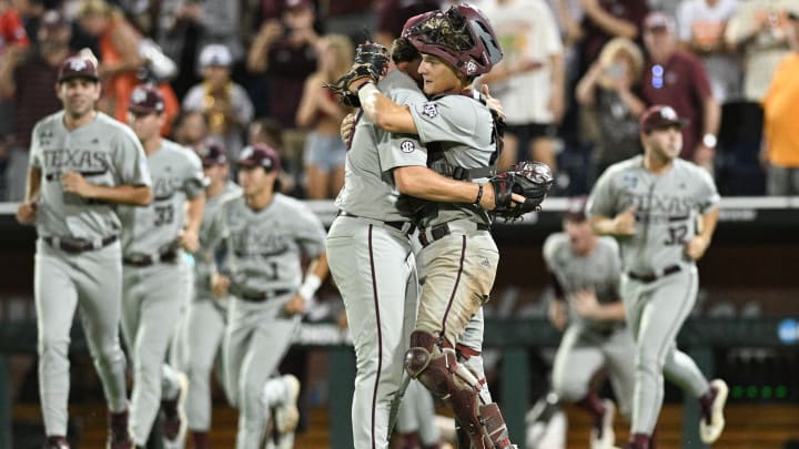 Jun 22, 2024; Omaha, NE, USA;  Texas A&M Aggies pitcher Evan Aschenbeck (53) and catcher Jackson Appel (20) celebrate after defeating the Tennessee Volunteers at Charles Schwab Field Omaha. Mandatory Credit: Steven Branscombe-USA TODAY Sports