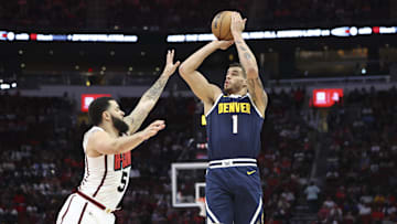 Mar 23, 2025; Houston, Texas, USA; Denver Nuggets forward Michael Porter Jr. (1) shoots the ball as Houston Rockets guard Fred VanVleet (5) defends during the third quarter at Toyota Center. Mandatory Credit: Troy Taormina-Imagn Images