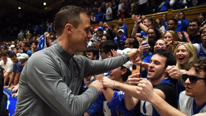 Feb 7, 2024; Durham, North Carolina, USA; Duke basketball head coach Jon Scheyer shakes hands  with fans after a game against the Notre Dame Fighting Irish at Cameron Indoor Stadium