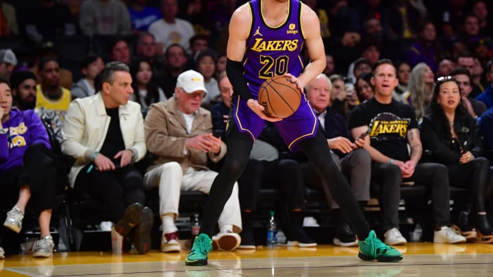 Jan 11, 2024; Los Angeles, California, USA; Los Angeles Lakers guard Dylan Windler (20) controls the ball against the Phoenix Suns during the second half at Crypto.com Arena. Mandatory Credit: Gary A. Vasquez-USA TODAY Sports