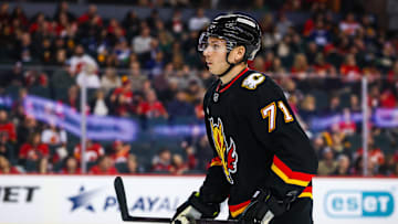 Dec 31, 2024; Calgary, Alberta, CAN; Calgary Flames right wing Walker Duehr (71) against the Vancouver Canucks during the first period at Scotiabank Saddledome. Mandatory Credit: Sergei Belski-Imagn Images