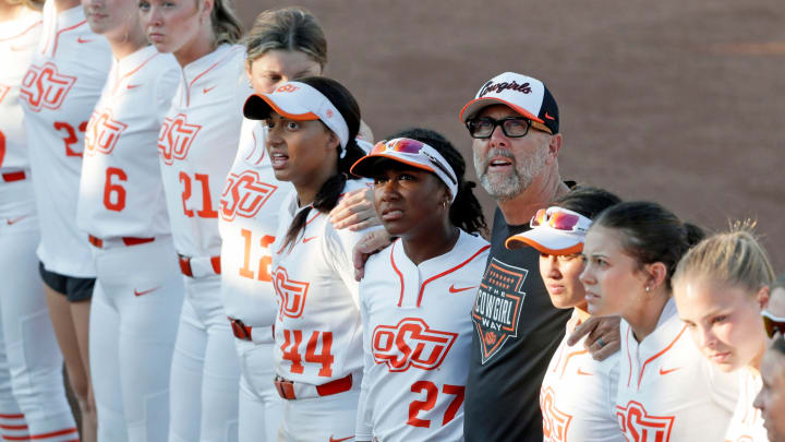 Oklahoma State coach Kenny Gajewski sings the alma mater with his team