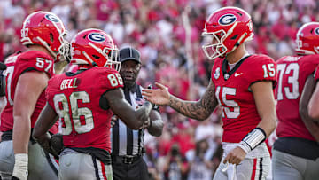Oct 5, 2024; Athens, Georgia, USA; Georgia Bulldogs wide receiver Dillon Bell (86) reacts with quarterback Carson Beck (15) after catching a touchdown pass against the Auburn Tigers during the second half at Sanford Stadium. Mandatory Credit: Dale Zanine-Imagn Images