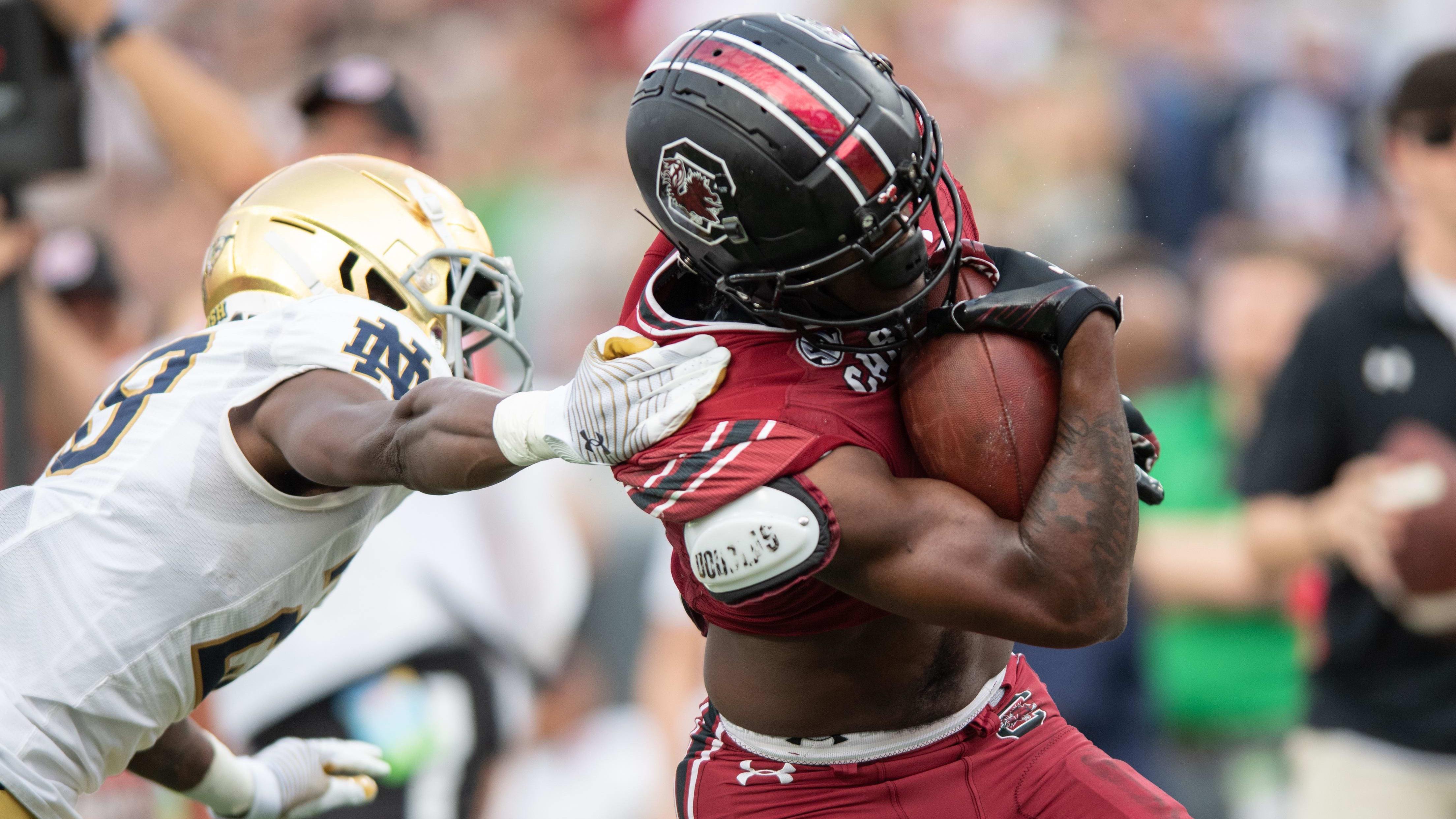 South Carolina Gamecocks wide receiver Xavier Legette (17) runs through an arm tackle.