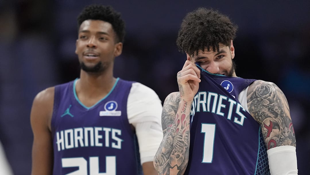 Charlotte Hornets guard LaMelo Ball (1) and forward Brandon Miller (24) watch a free throw attempt