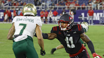 Nov 1, 2024; Boca Raton, Florida, USA;  South Florida Bulls wide receiver Michael Brown-Stephens (7) runs past Florida Atlantic Owls defensive back Kahzir Brown (11) during the second half at FAU Stadium. Credit: Reinhold Matay-Imagn Images