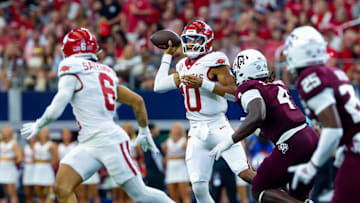 Sep 28, 2024; Arlington, Texas, USA;  Arkansas Razorbacks quarterback Taylen Green (10) throws to Arkansas Razorbacks wide receiver Isaiah Sategna (6) during the second half against the Texas A&M Aggies at AT&T Stadium. Mandatory Credit: Kevin Jairaj-Imagn Images