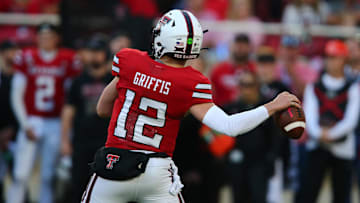 Oct 25, 2025; Lubbock, Texas, USA;  Texas Tech Red Raiders quarterback Mitch Griffis (12) passes against the Oklahoma State Cowboys in the second half at Jones AT&T Stadium. Mandatory Credit: Michael C. Johnson-Imagn Images