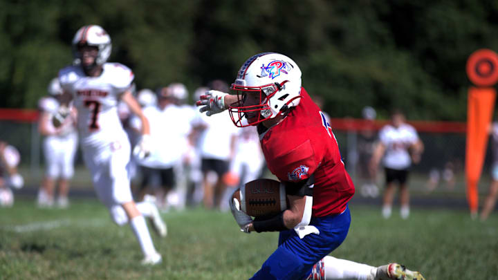 Pawnee's Dakoda Koyne runs after the catch against Kincaid South Fork during an 8-Man football game Saturday, Sept. 14, 2024.