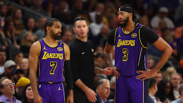 Oct 28, 2024; Phoenix, Arizona, USA; Los Angeles Lakers head coach JJ Redick with guard Gabe Vincent (7) and forward Anthony Davis (3) against the Phoenix Suns at Footprint Center. Mandatory Credit: Mark J. Rebilas-Imagn Images