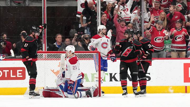 May 29, 2026; Raleigh, North Carolina, USA; Carolina Hurricanes defenseman Shayne Gostisbehere (4) celebrates with center Sebastian Aho (20) and right wing Andrei Svechnikov (37) after scoring a power play goal against the Montreal Canadiens in game five of the Eastern Conference Final of the 2026 Stanley Cup Playoffs during the second period at Lenovo Center. Mandatory Credit: James Guillory-Imagn Images