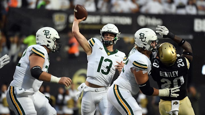 Sep 21, 2024; Boulder, Colorado, USA; Baylor Bears quarterback Sawyer Robertson (13) attempts a pass during the first half against the Colorado Buffaloes at Folsom Field. Mandatory Credit: Christopher Hanewinckel-Imagn Images