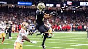 Sep 14, 2025; New Orleans, Louisiana, USA;  New Orleans Saints wide receiver Chris Olave (12) catches a pass against San Francisco 49ers cornerback Upton Stout (20) during the second half at Caesars Superdome. Mandatory Credit: Stephen Lew-Imagn Images