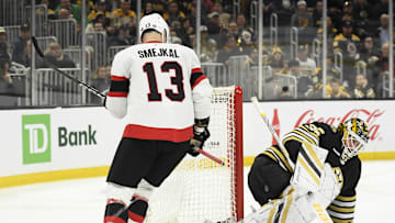 Apr 16, 2024; Boston, Massachusetts, USA;  Ottawa Senators left wing Jiri Smejkal (13) looks behind Boston Bruins goaltender Linus Ullmark (35) as the puck crosses the goalie for a goal during the second period at TD Garden. Mandatory Credit: Bob DeChiara-Imagn Images