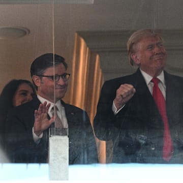 Dec 14, 2024; Landover, Maryland, USA; U.S. President-elect Donald Trump (center), Vice President-elect JD Vance (right), and Speaker of the House Mike Johnson (left) look on during the Navy vs Army game at Northwest Stadium. Mandatory Credit: Tommy Gilligan-Imagn Images