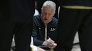 Purdue Boilermakers head coach Matt Painter leads a team huddle 
